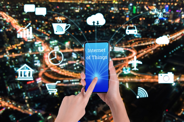 woman-hand-using-smart-phone-in-concept-internet-of-things-with-night-modern-city-background