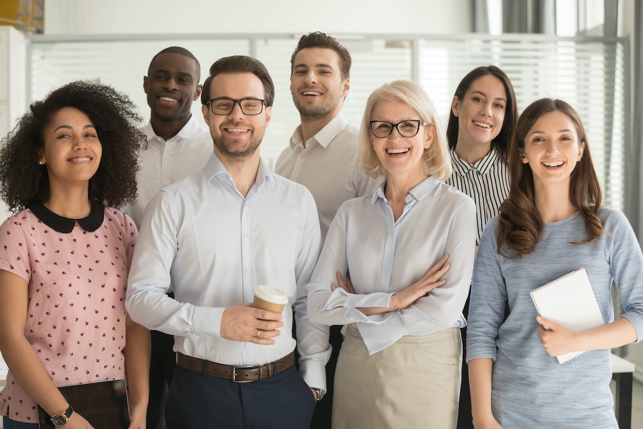 smiling-diverse-employees-posing-for-photo-in-office