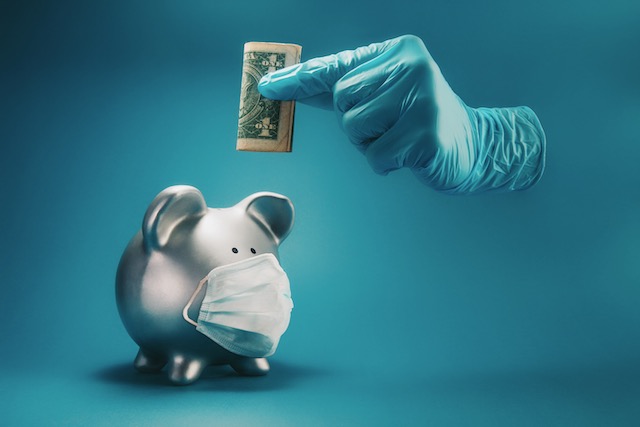 concept-of-saving-money-during-the-time-of-infectious-disease-pandemic.-a-hand-inside-protective--surgical-glove-holding-money-above-piggy-bank-with-face-mask